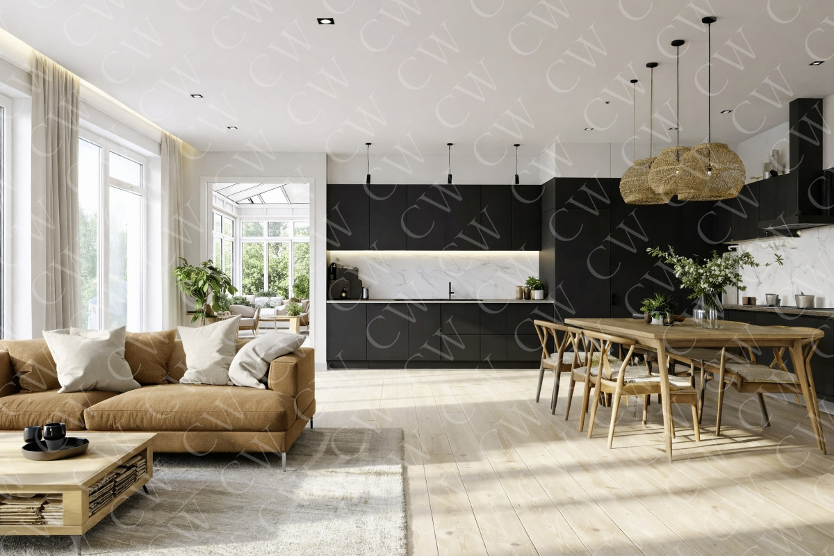 Ein modernes, helles Wohnzimmer mit braunem Sofa und angrenzender schwarzer Einbauküche.