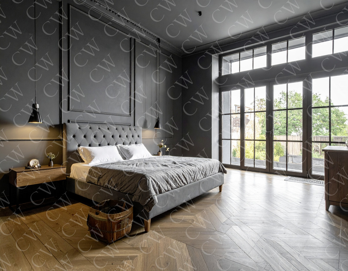 Modern eingerichtetes Schlafzimmer mit grauen Wänden, großem Bett und bodentiefen Fenstern.