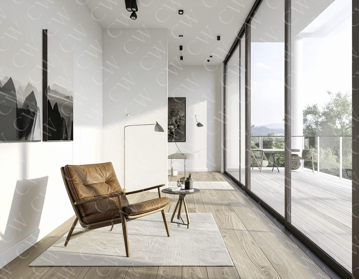 Helles Wohnzimmer mit Lederstuhl, Wandbildern und großer Glasfront zur Terrasse.