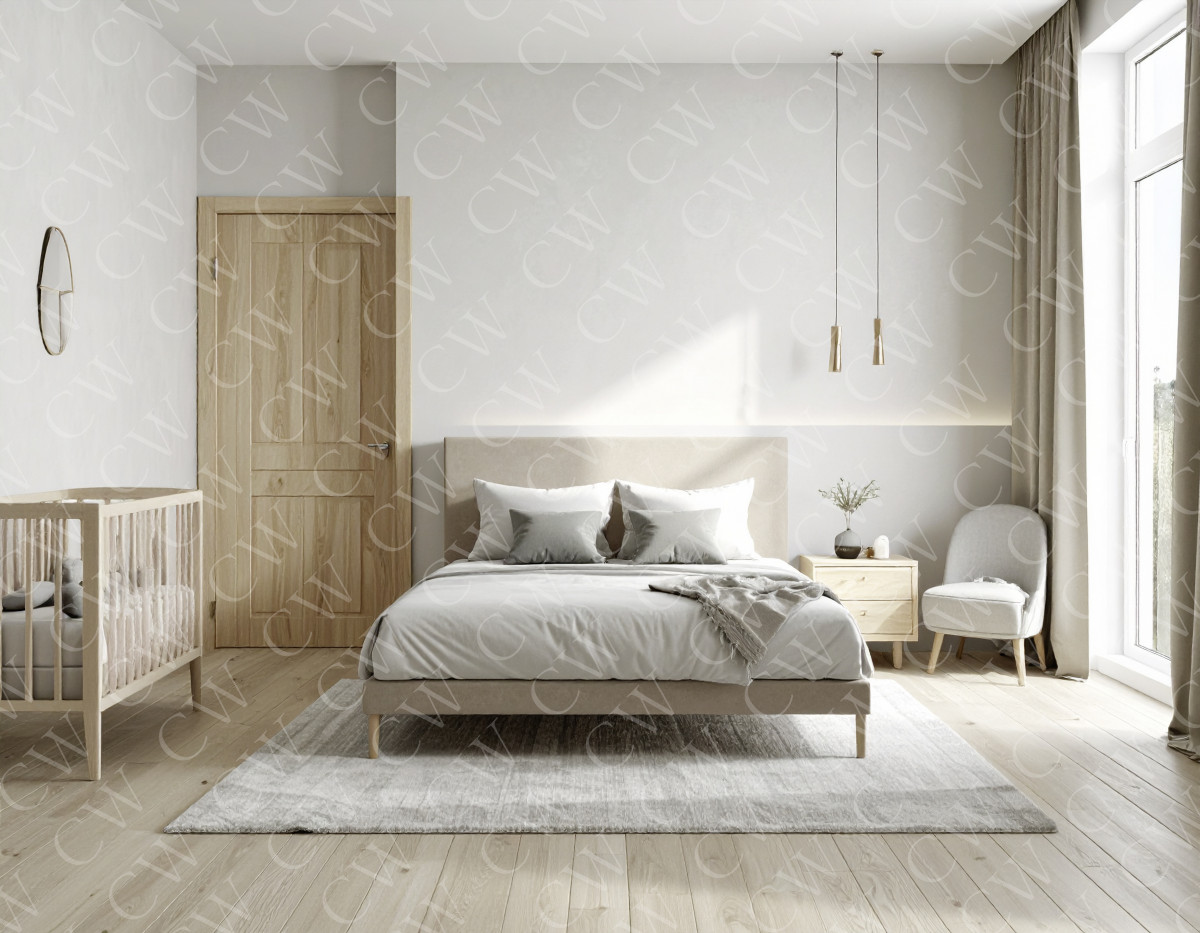 Helles Schlafzimmer mit Doppelbett, Babybett, Sessel, Nachttisch und großen Fenstern.